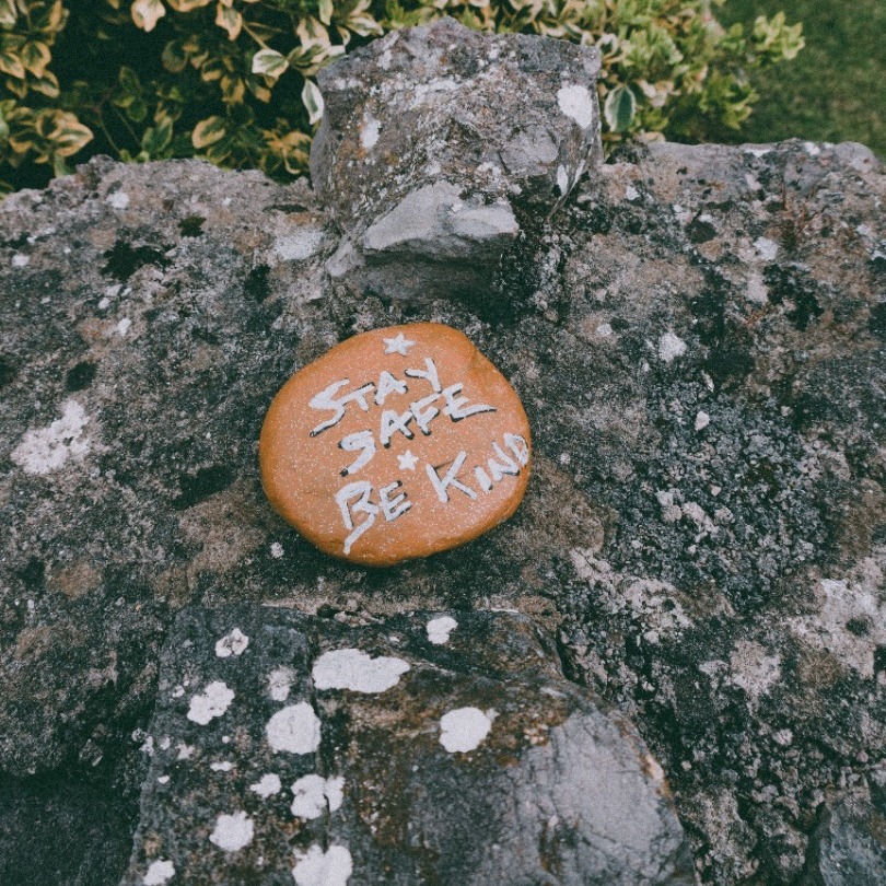 A pebble engraved with - Stay Safe, Be Kind