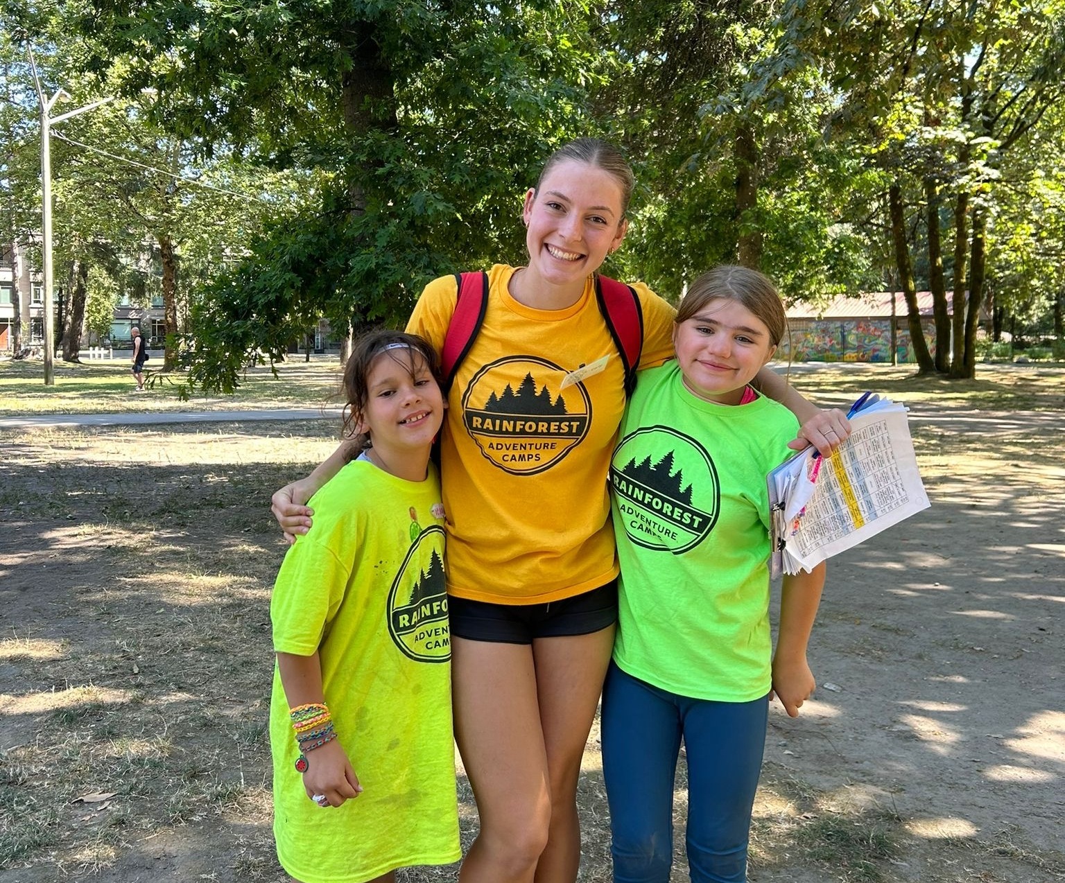 two smiling kids in the water at the beach